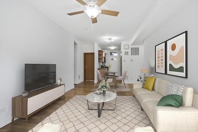 living room featuring ceiling fan and light hardwood / wood-style floors