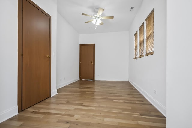 spare room with ceiling fan and light hardwood / wood-style flooring