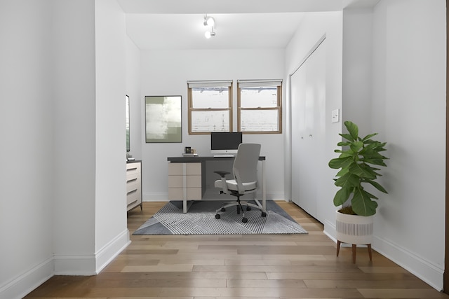 office space with light wood-type flooring