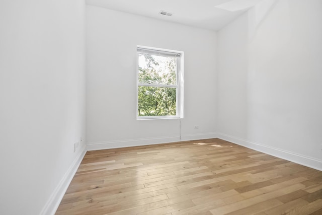 empty room with light hardwood / wood-style floors