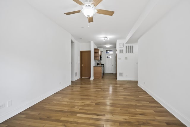 empty room with ceiling fan and wood-type flooring