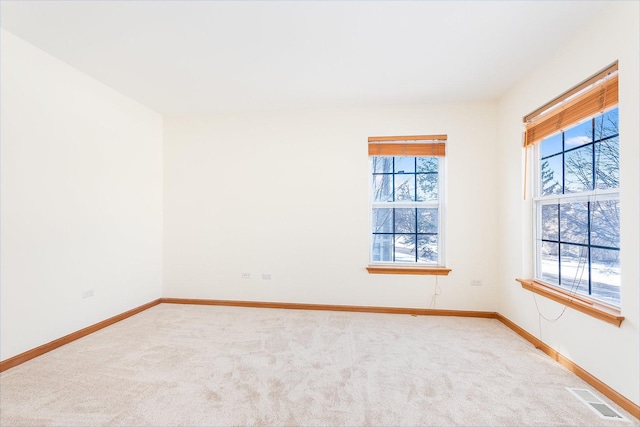 empty room featuring carpet flooring