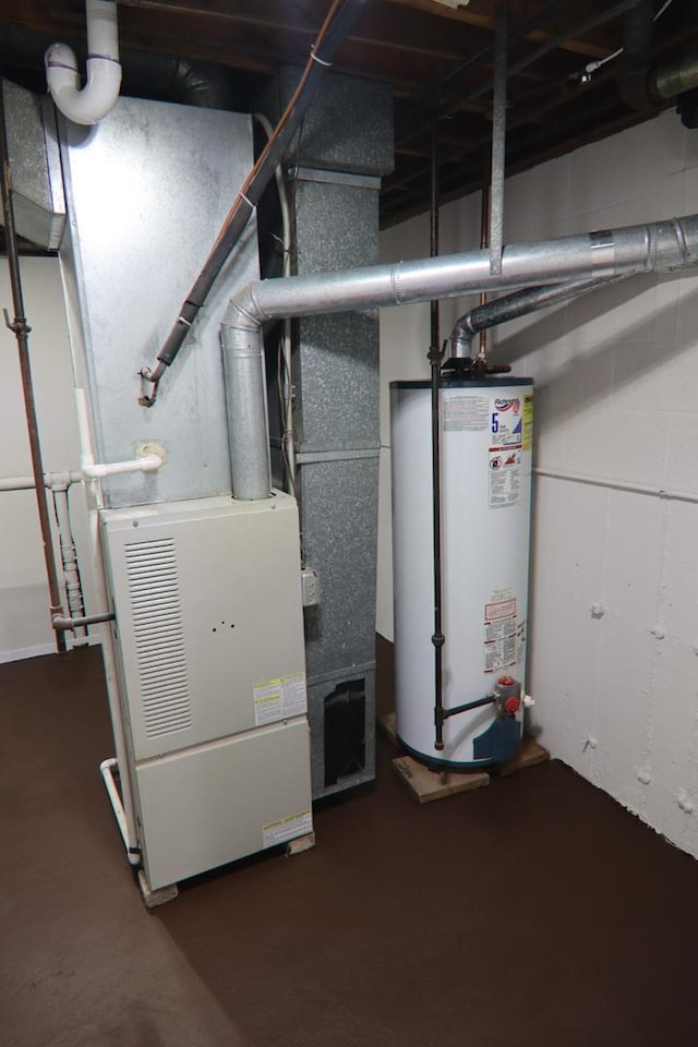 utility room featuring gas water heater