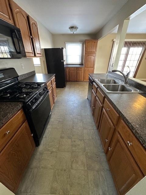 kitchen featuring black appliances and sink