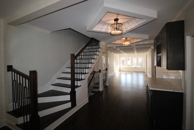 stairs featuring crown molding and a notable chandelier