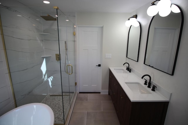 bathroom featuring vanity, independent shower and bath, and tile patterned flooring