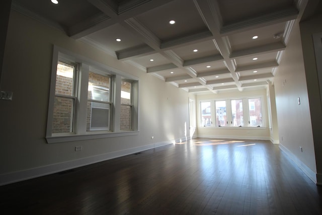 empty room featuring beam ceiling, wood-type flooring, crown molding, and coffered ceiling