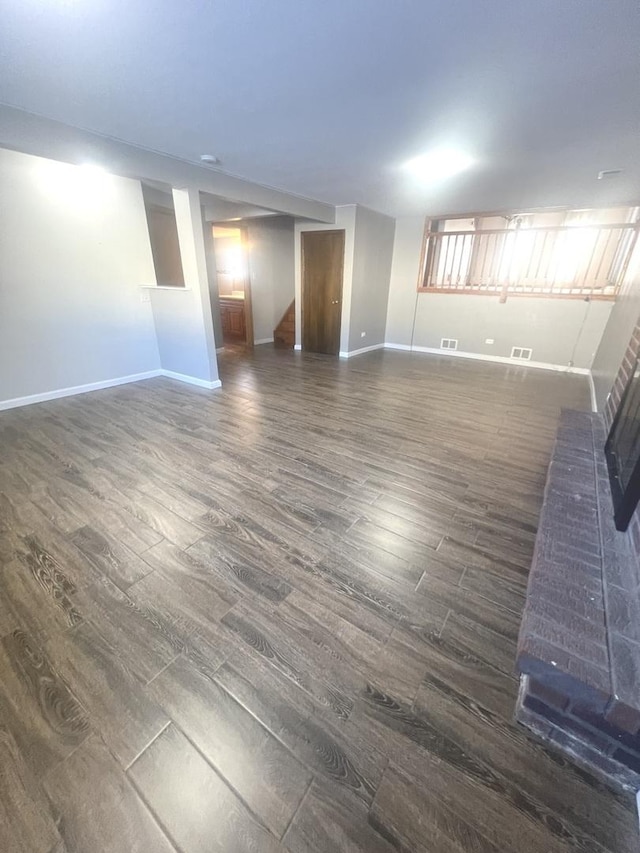 spare room featuring dark hardwood / wood-style flooring