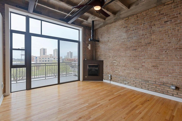 2545 S Dearborn St Unit 508, Chicago, IL 60616 - unfurnished living room with a city view, wood ceiling, beam ceiling, baseboards, and wood finished floors
