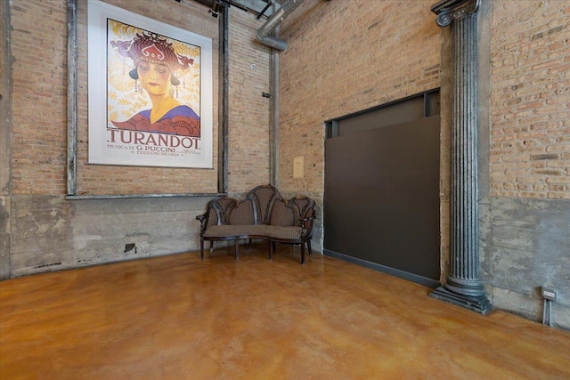 2545 S Dearborn St Unit 508, Chicago, IL 60616 - unfurnished room with brick wall, finished concrete floors, and a high ceiling