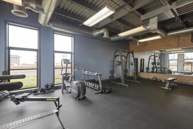 2545 S Dearborn St Unit 508, Chicago, IL 60616 - gym with brick wall and a high ceiling