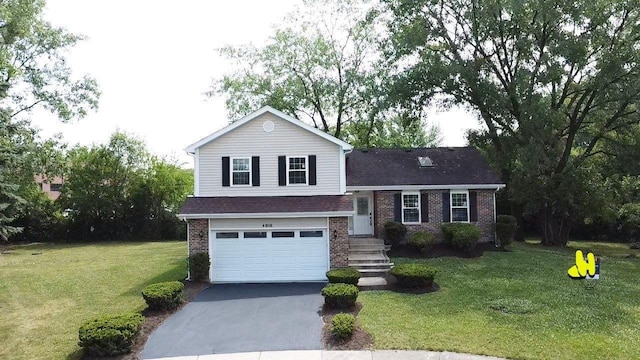 tri-level home with a front lawn and a garage