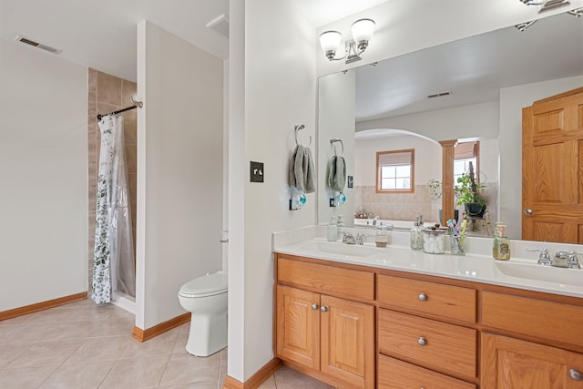 bathroom featuring vanity, toilet, curtained shower, and tile patterned flooring