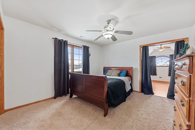 bedroom with light colored carpet and ceiling fan