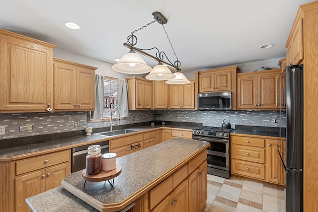 kitchen with pendant lighting, a kitchen island, double oven range, sink, and black fridge