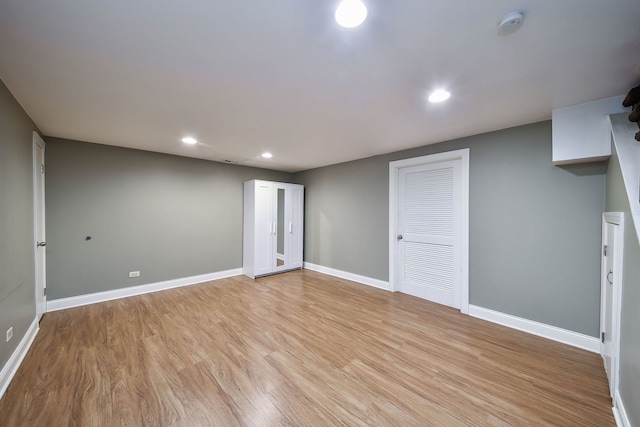 empty room with light hardwood / wood-style floors