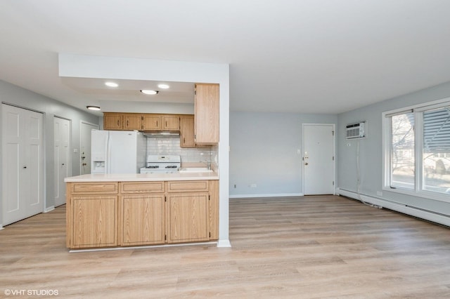 kitchen with white fridge with ice dispenser, range, sink, backsplash, and kitchen peninsula