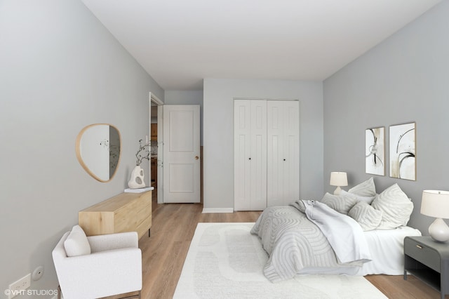 bedroom featuring a closet and light hardwood / wood-style floors