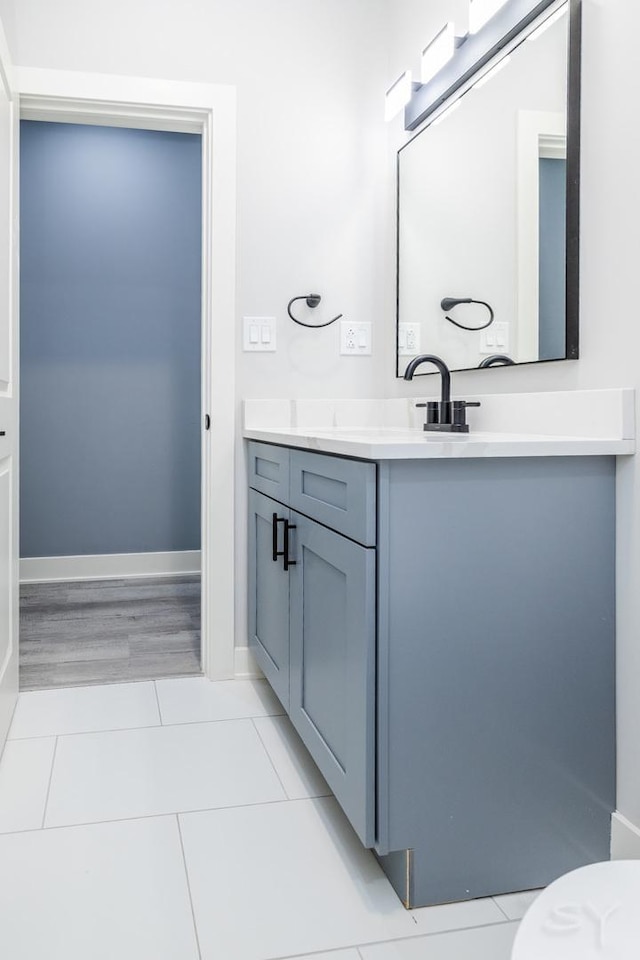 bathroom with vanity and tile patterned flooring