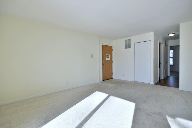 spare room featuring carpet flooring