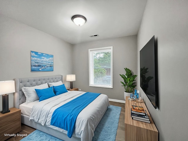 bedroom featuring wood-type flooring