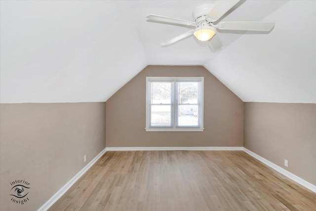 additional living space featuring light wood-type flooring, ceiling fan, and lofted ceiling