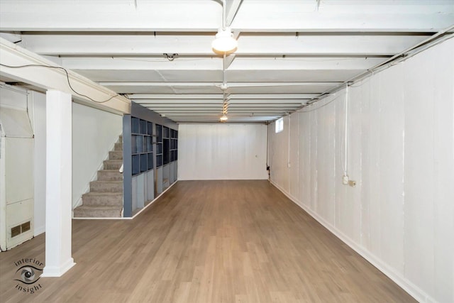 basement with wood-type flooring