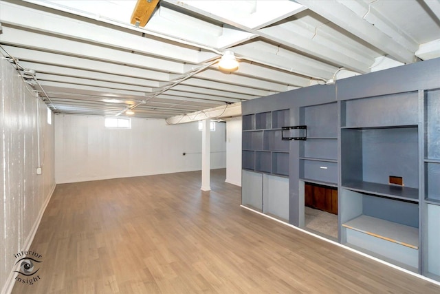 basement featuring hardwood / wood-style floors