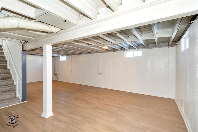 basement with hardwood / wood-style floors and plenty of natural light