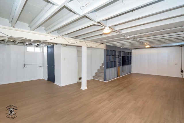 basement featuring hardwood / wood-style floors