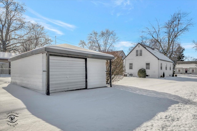 view of snow covered garage