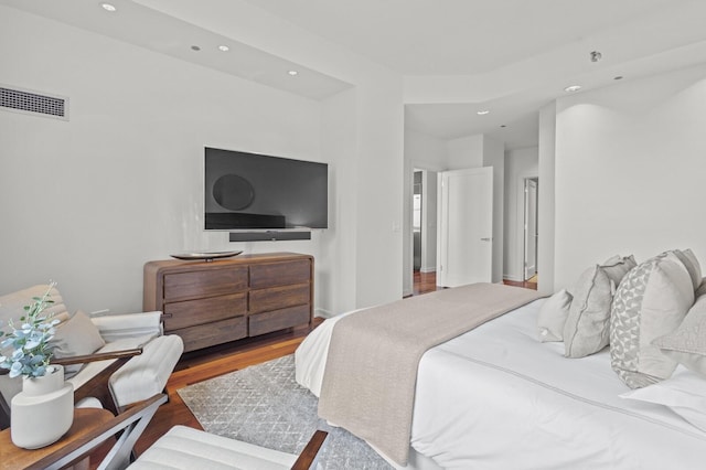 bedroom with wood-type flooring