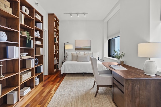 bedroom featuring dark hardwood / wood-style flooring