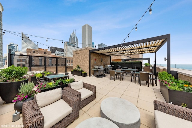 view of patio with an outdoor living space, radiator, grilling area, a water view, and a pergola