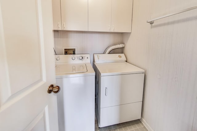 washroom featuring cabinets and washing machine and clothes dryer