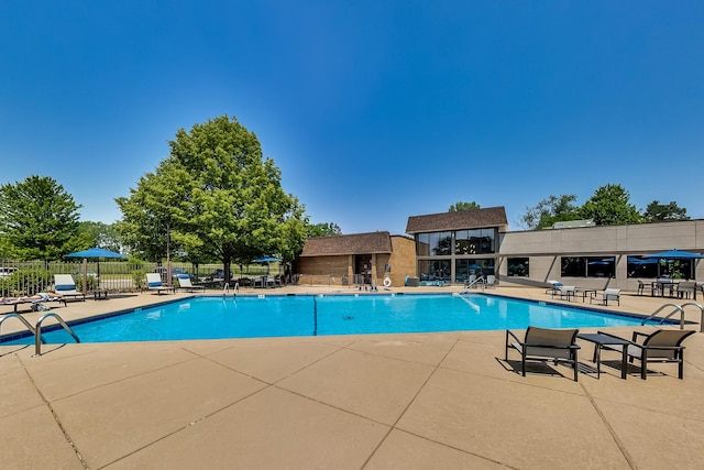 view of swimming pool featuring a patio area