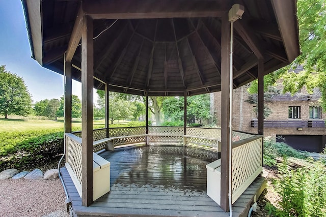 dock area featuring a gazebo and a deck