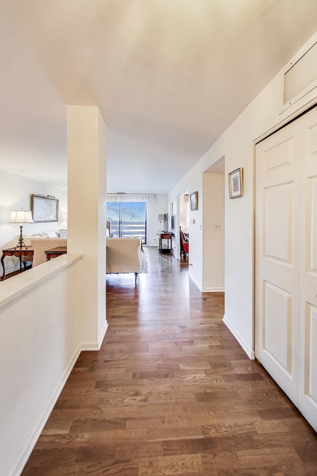 hall with dark hardwood / wood-style floors