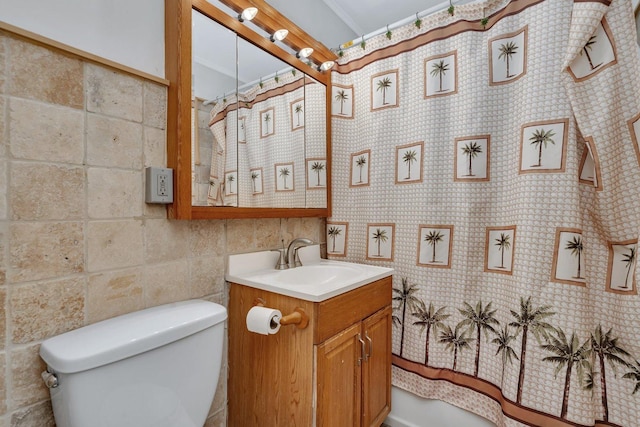 bathroom featuring toilet, vanity, ornamental molding, and a shower with curtain