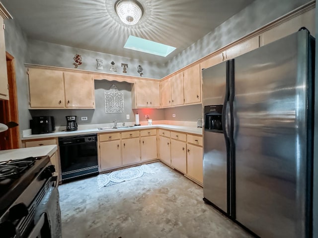 kitchen with sink, a skylight, light brown cabinetry, and appliances with stainless steel finishes