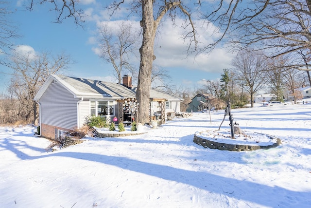 view of yard layered in snow