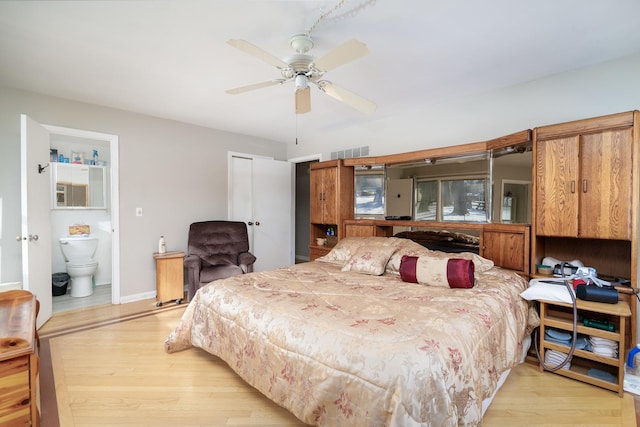 bedroom featuring connected bathroom, ceiling fan, and light hardwood / wood-style floors