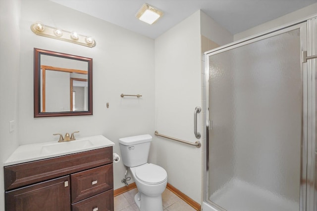 bathroom with toilet, tile patterned floors, a shower with door, and vanity