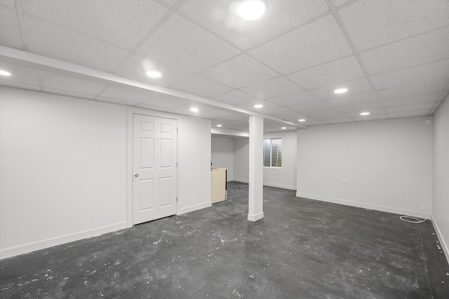 basement featuring a drop ceiling