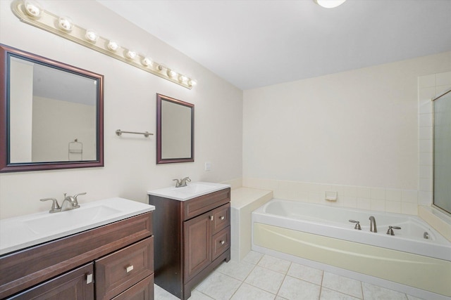 bathroom featuring independent shower and bath, tile patterned floors, and vanity