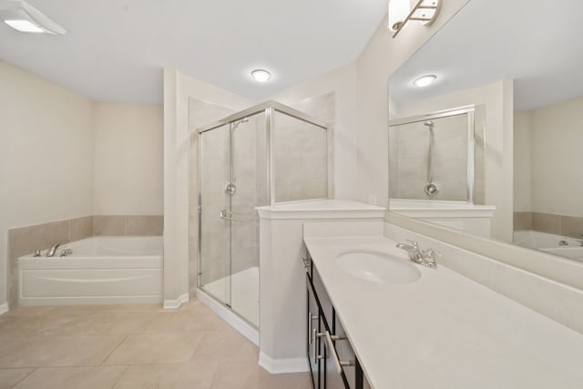 bathroom with vanity, tile patterned floors, and independent shower and bath