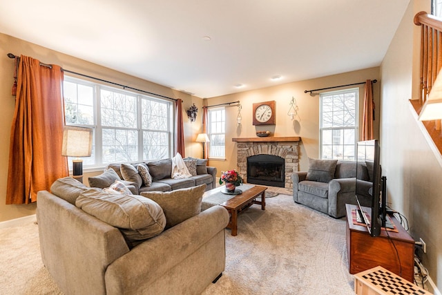 living room featuring light colored carpet and a fireplace