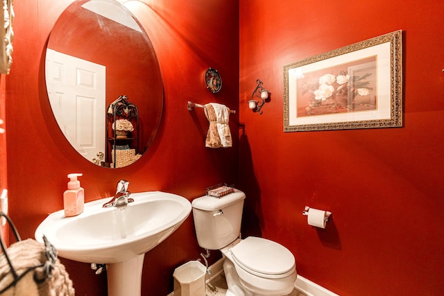 bathroom featuring sink and toilet