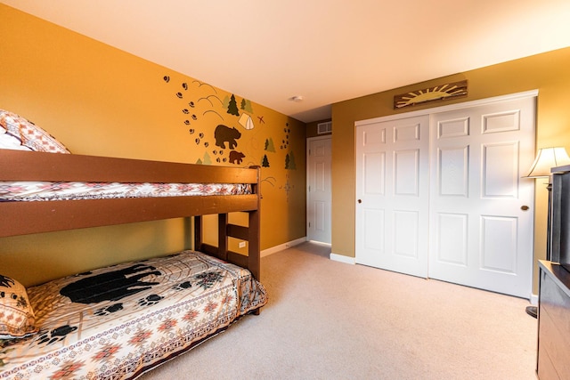 bedroom featuring a closet and carpet