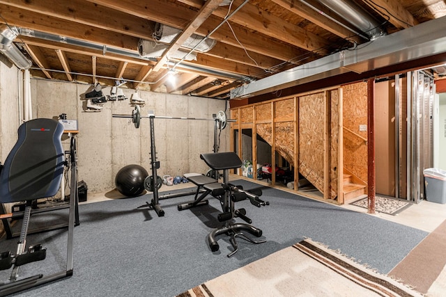 workout area featuring light carpet